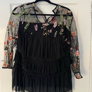 Black top with sheer floral neckline and sleeves. Worn one time!